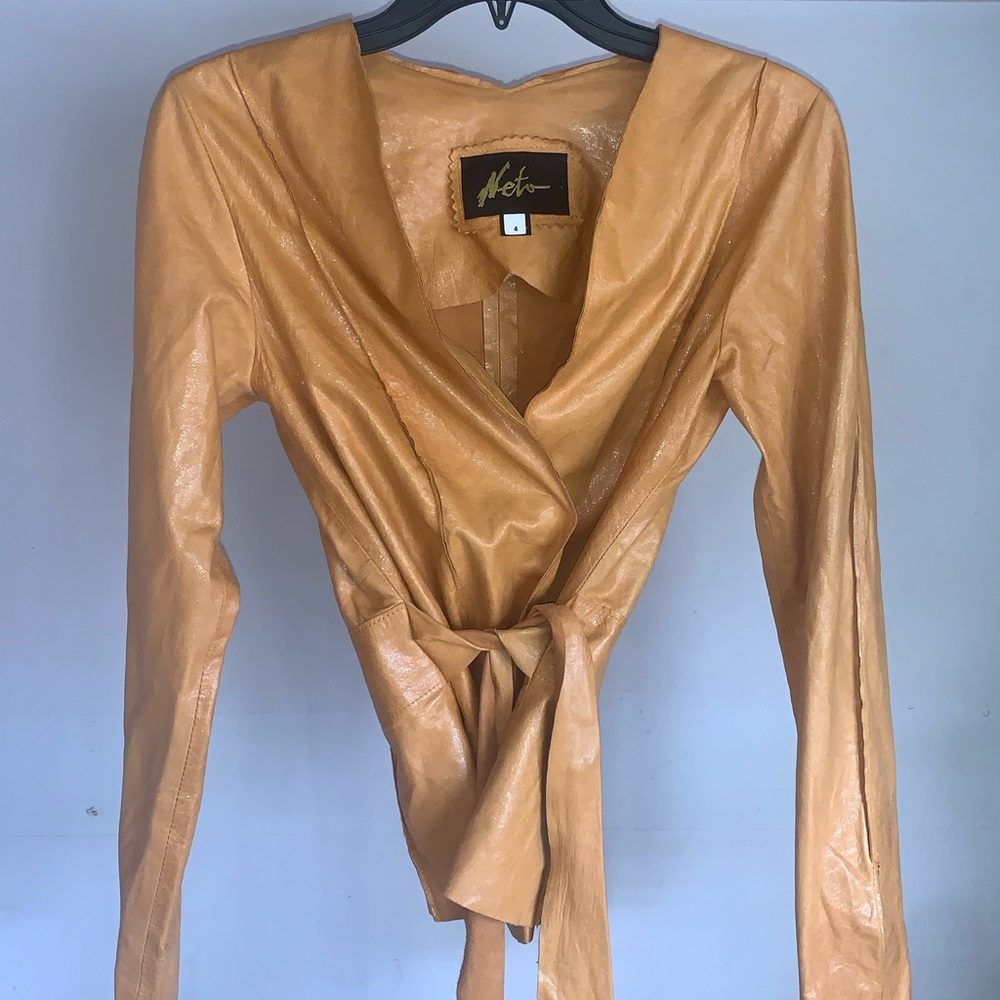 Woman’s designer leather jacket color orange size 4 in perfect condition